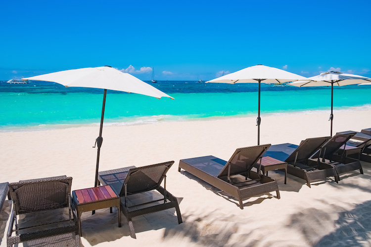 White sand beach with umbrellas Boracay island Philippines